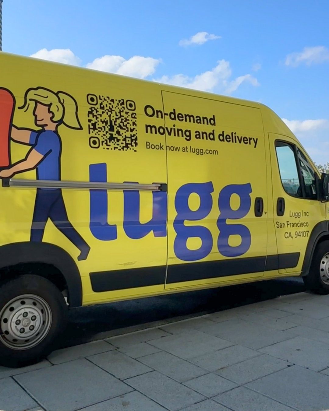 Bright yellow Lugg moving van with on-demand moving and delivery branding.