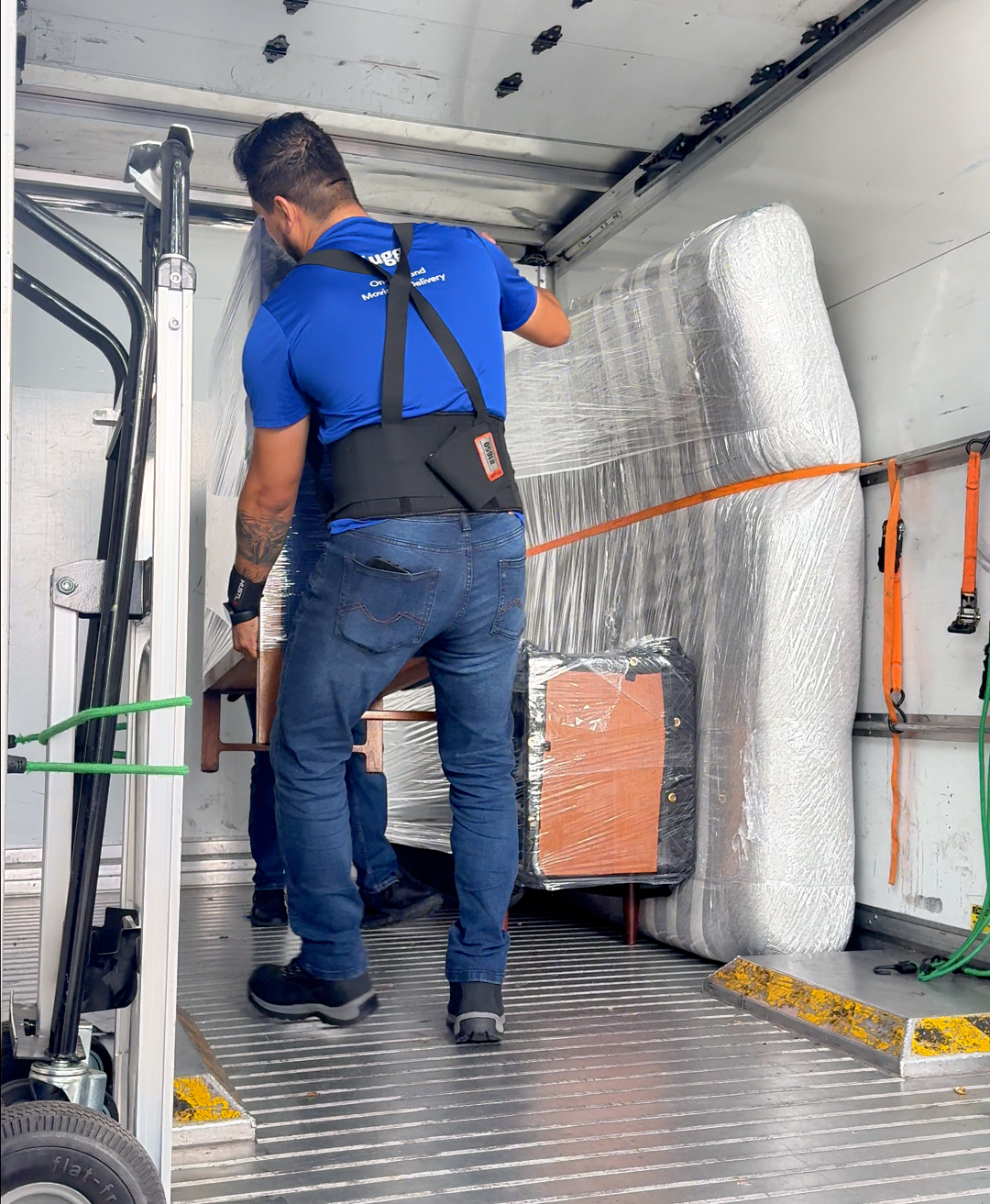 Wrapped furniture secured inside a Lugg box truck, showing interior space and capacity.