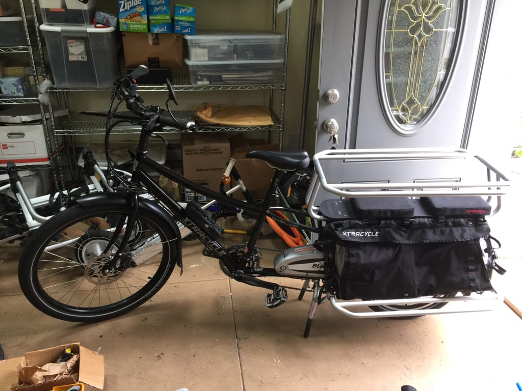 Extra-long bicycle in a customer's garage ready for Lugg pickup to The New Wheel bike shop, October 2016