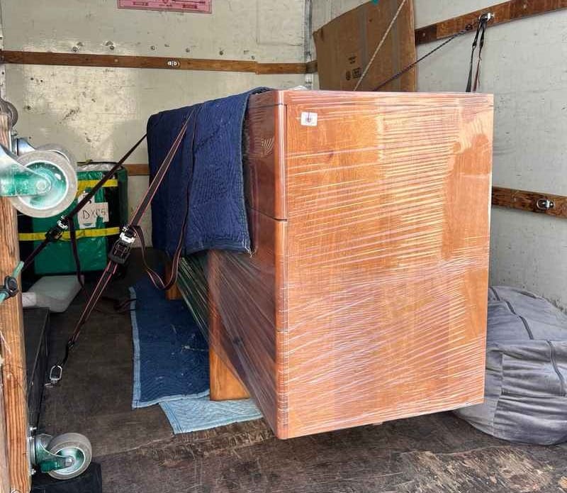 furniture from a Pottery Barn outlet secured inside a delivery truck for safe transport