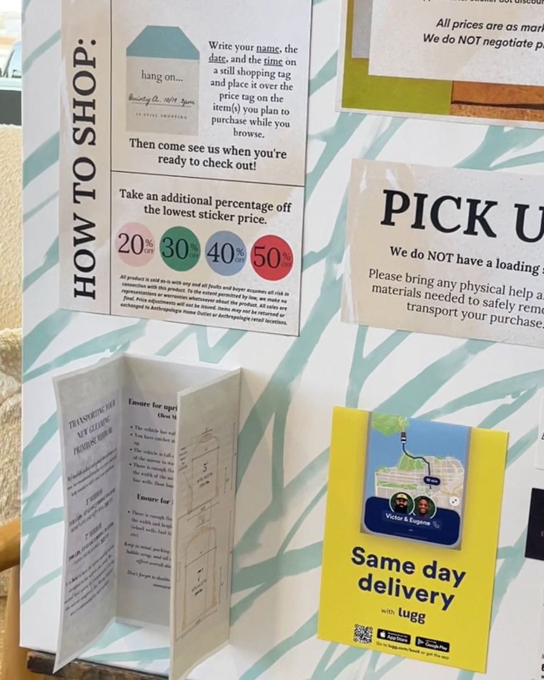 In-store signage at the Anthropologie Home Outlet explaining the dot sticker discount system and how to shop