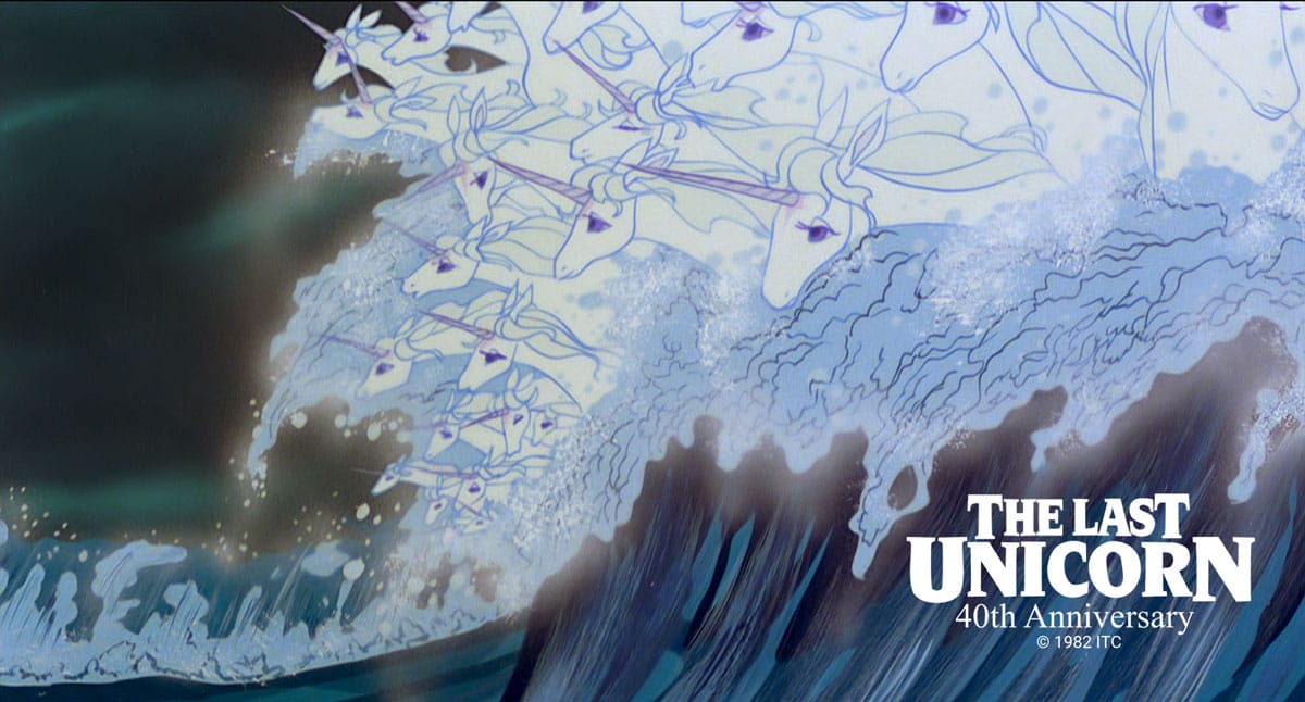 "An animated still from The Last Unicorn (40th Anniversary, 1982) showing a herd of ghostly white unicorns rushing through a crashing ocean wave."