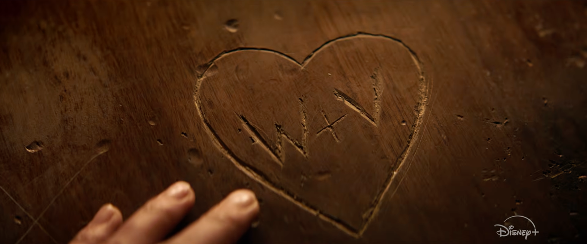W+V is carved on a bar top