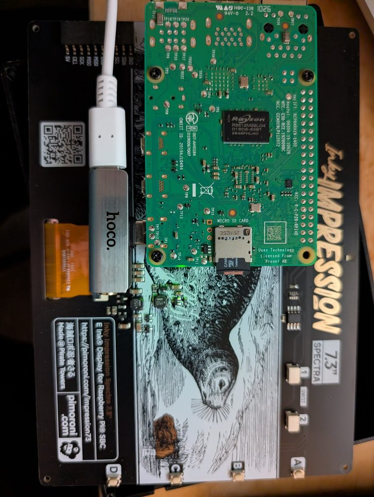 A bit of minicomputer circuitry; the main visible board has a cool monochrome etching of a grey seal