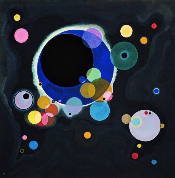 Black background with many circles of grey, turquoise, raspberry, etc, of various sizes, luminescent