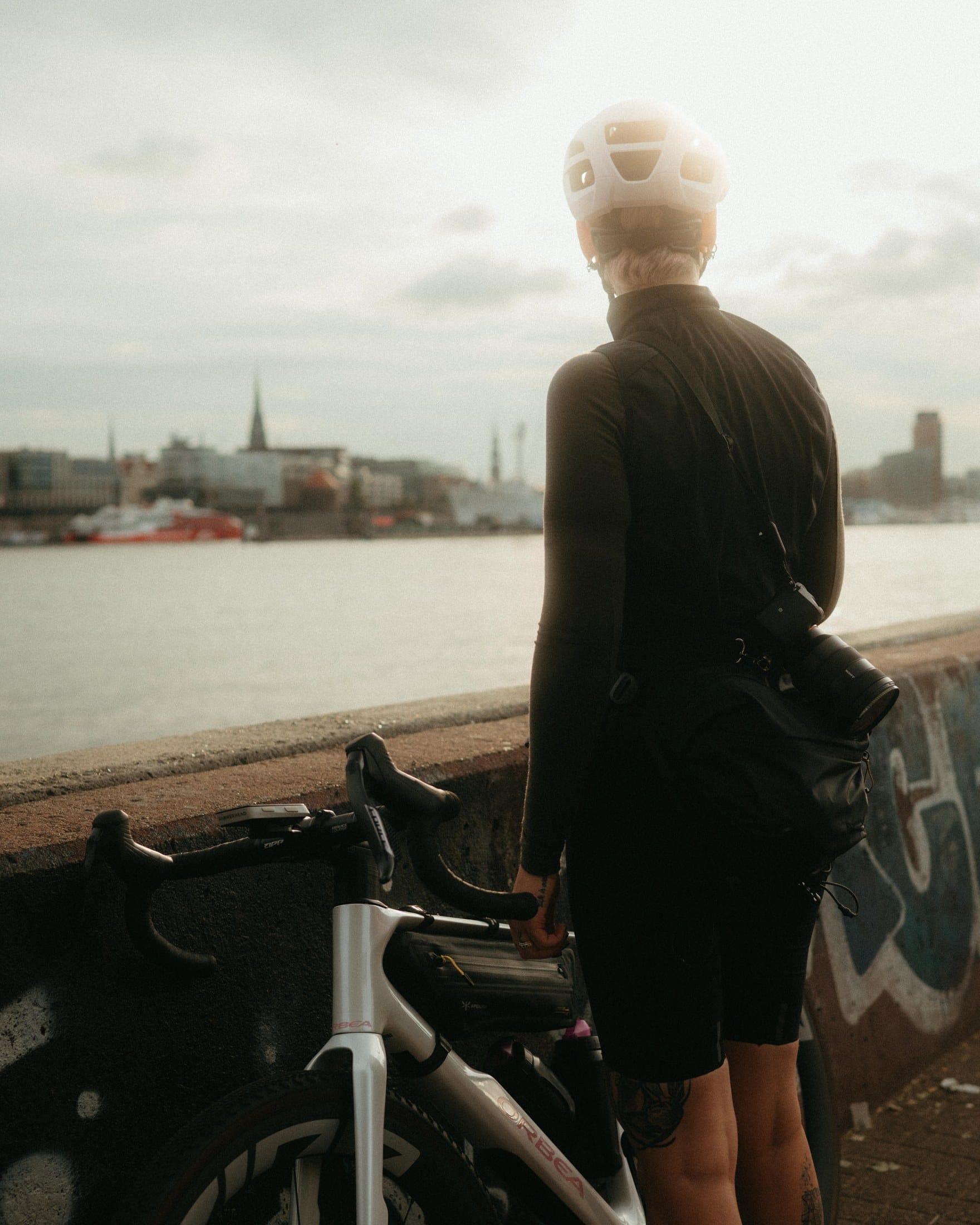 Jana beside the bicycles at the Hamburg waterfront