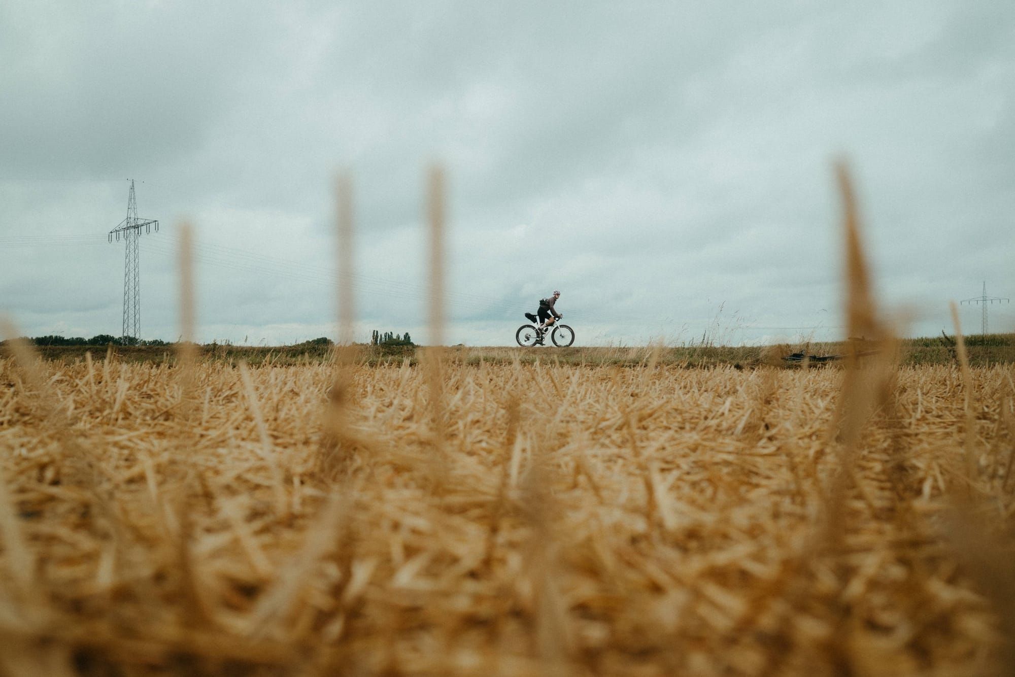 Jana riding beyond a harvested field