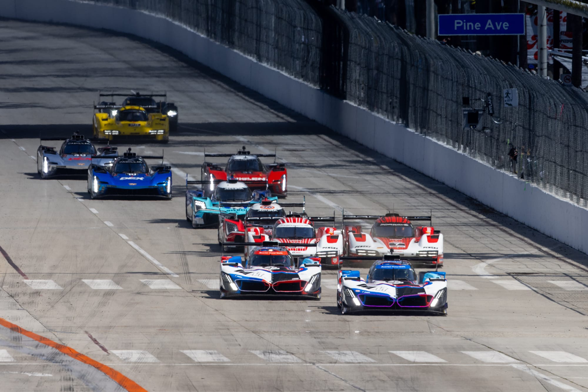 Race start at Long Beach, with the two BMWS leading the two Porsches.