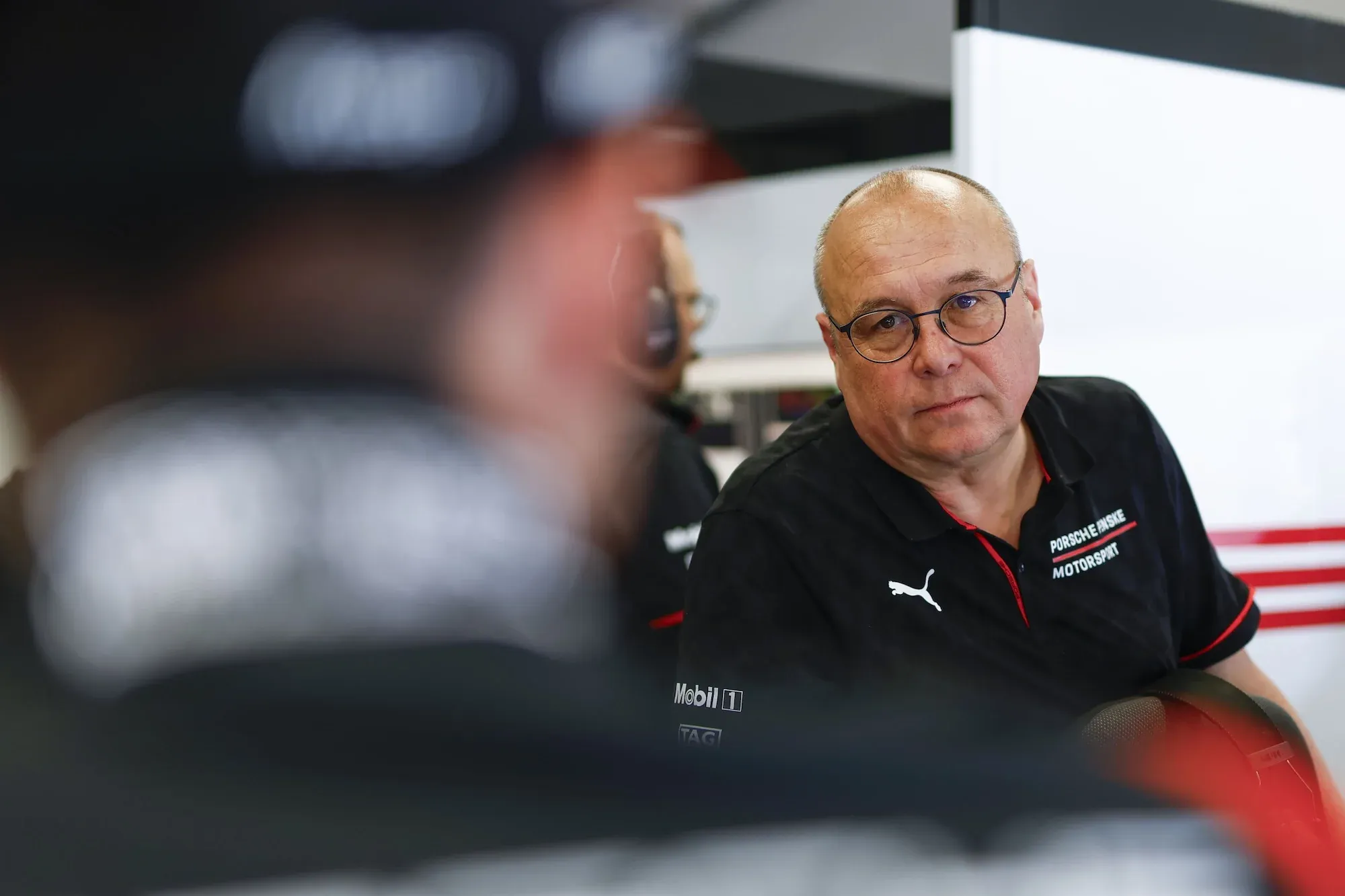 Urs Kuratle, Porsche's director of LMDh motorsport, in the Porsche garage