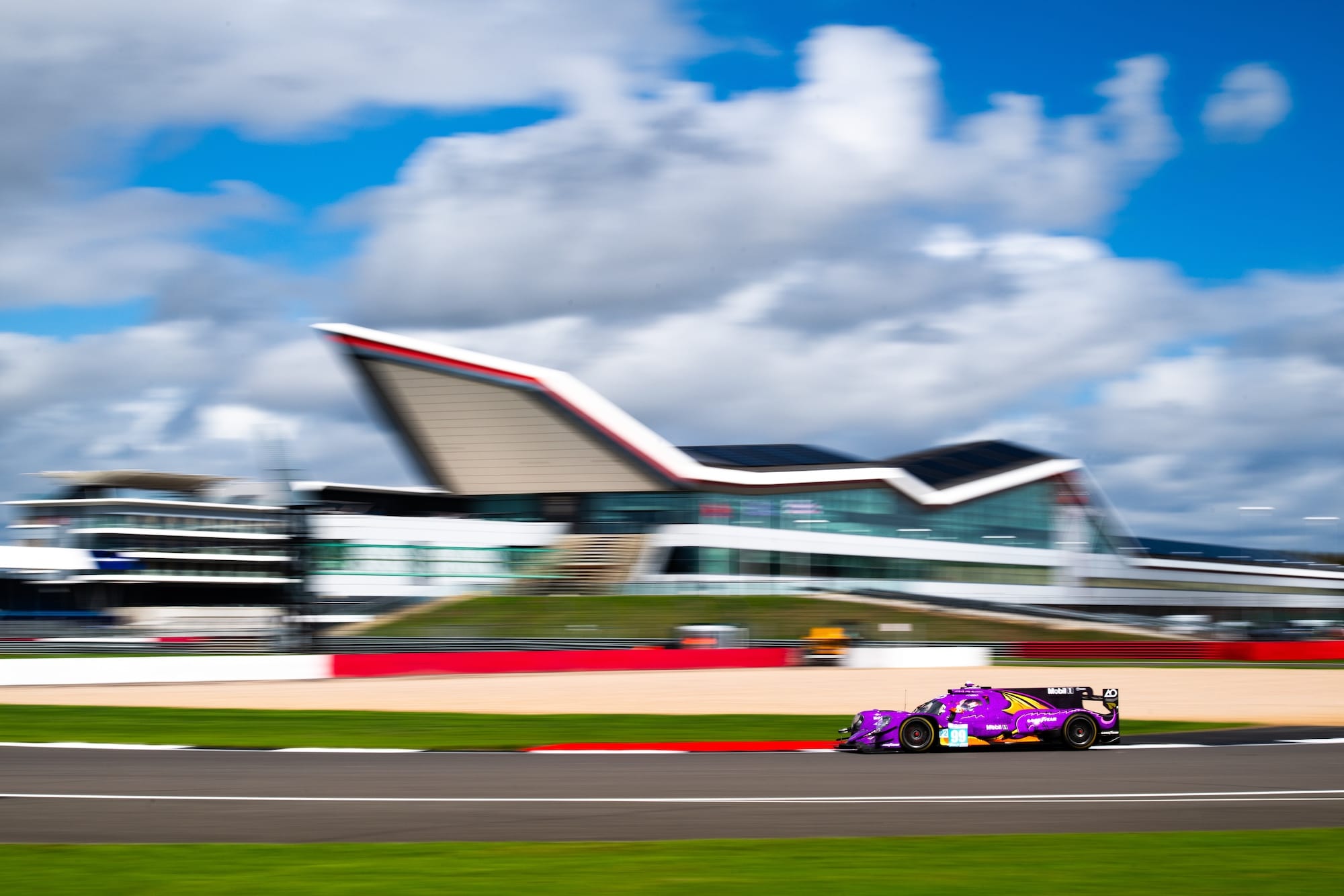 The #99 AO by TF Oreca at Silverstone with the Wing building in the background 