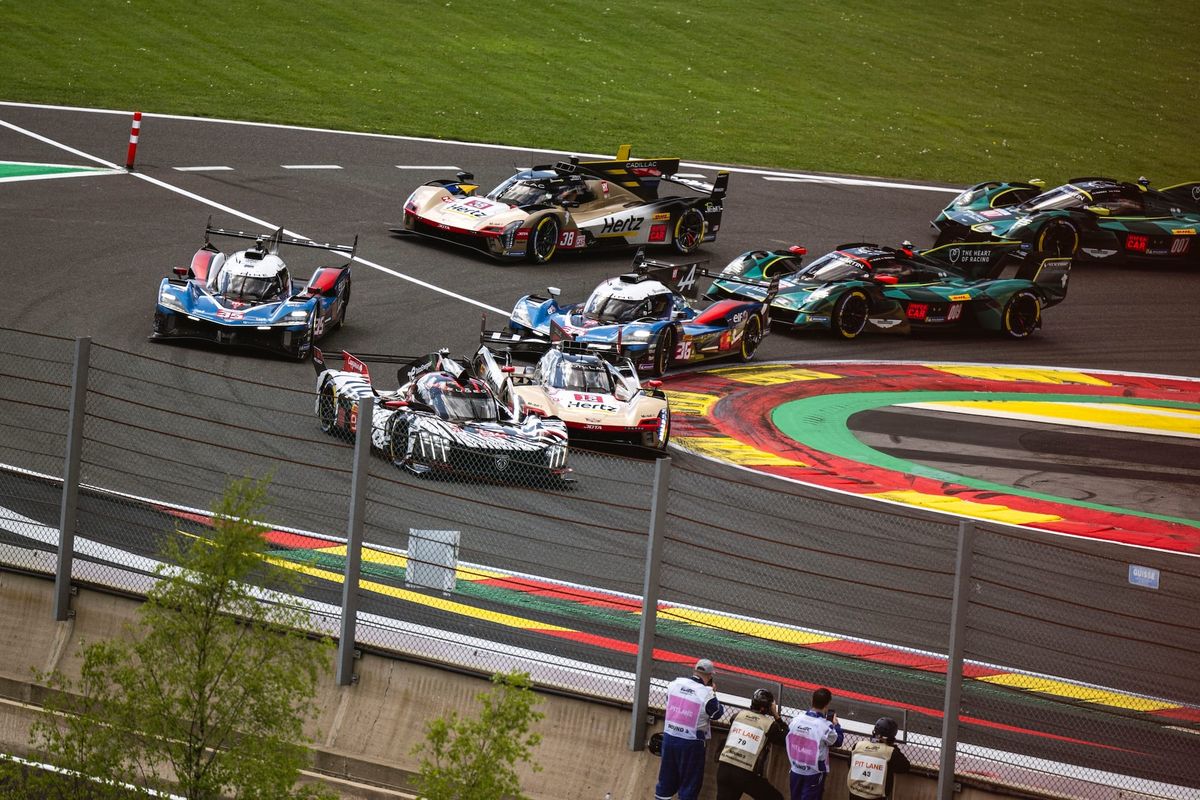 The 2026 Hypercar field at the Spa bus stop just before green flag, headed by the #94 Peugeot on pole
