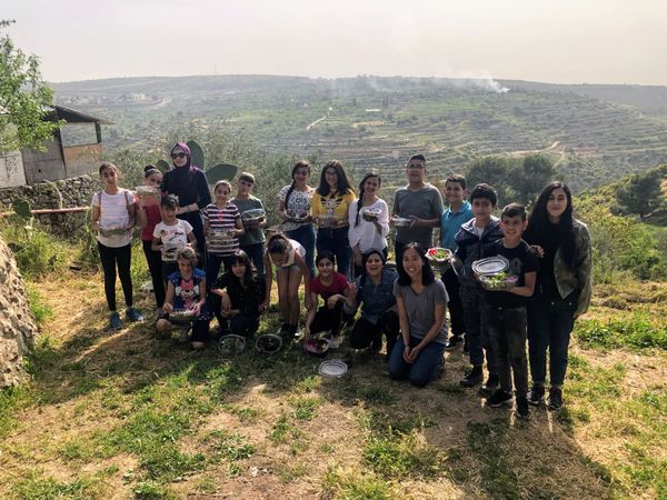 Crafting islands with raw almonds, poppies, and 20 kids from Dheisheh