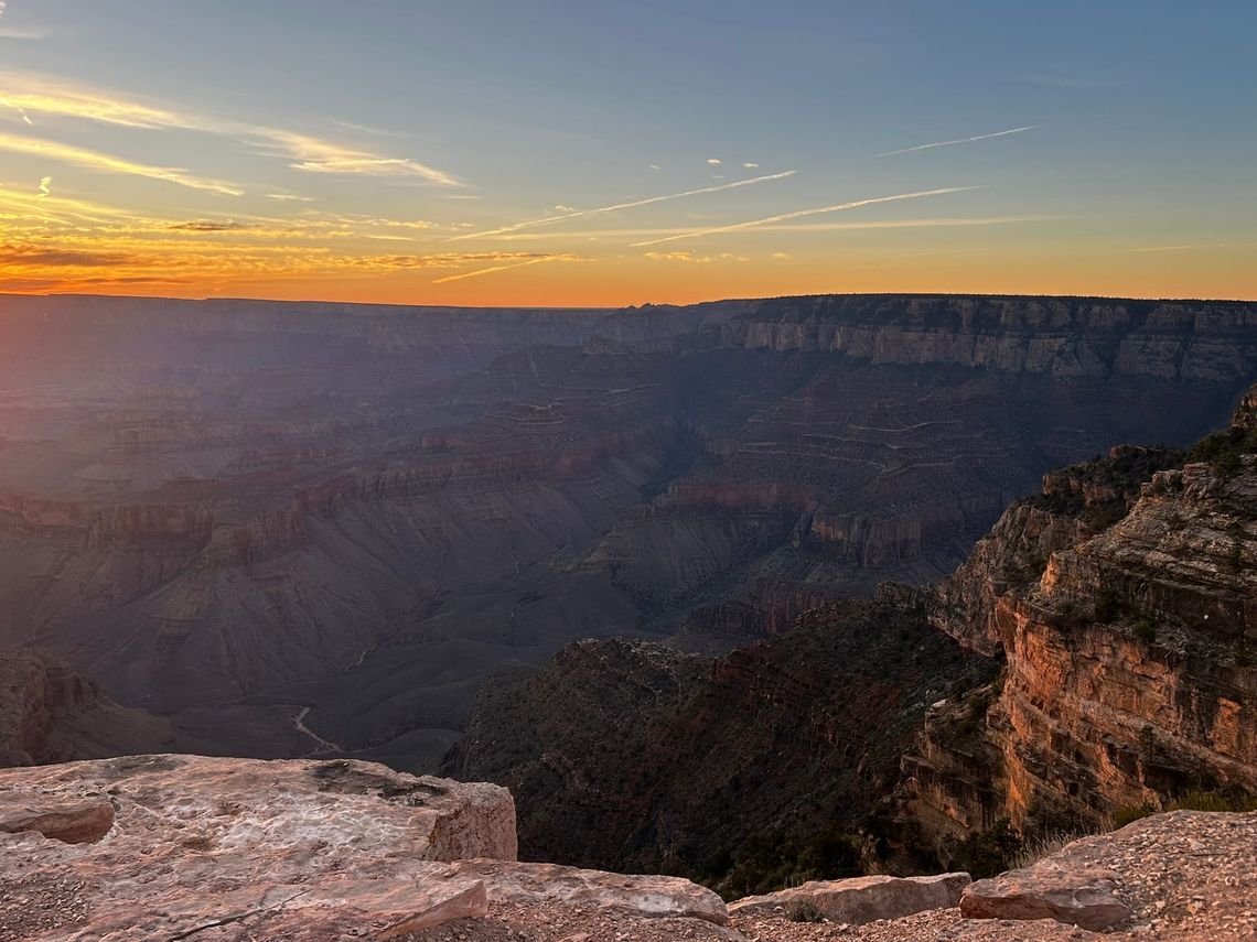 The Grand Canyon from the South Rim with warm light from the sunrise on the rock formations