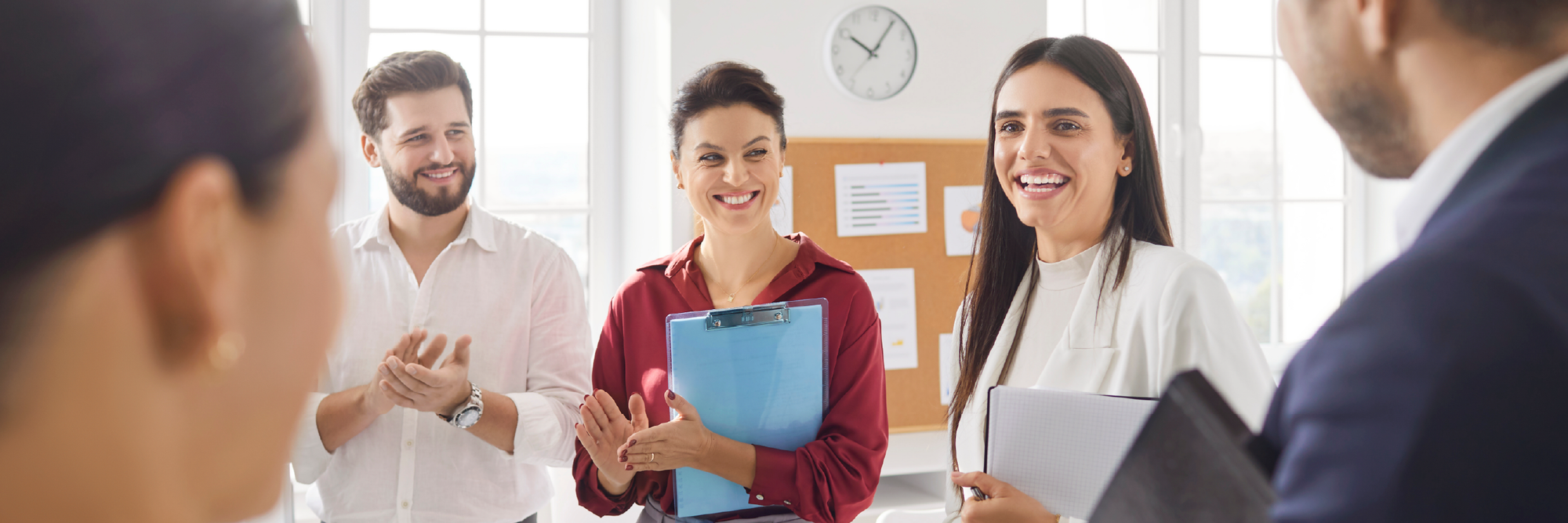 Group of employees smiling.
