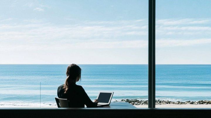Image of a female solopreneur looking out over the ocean