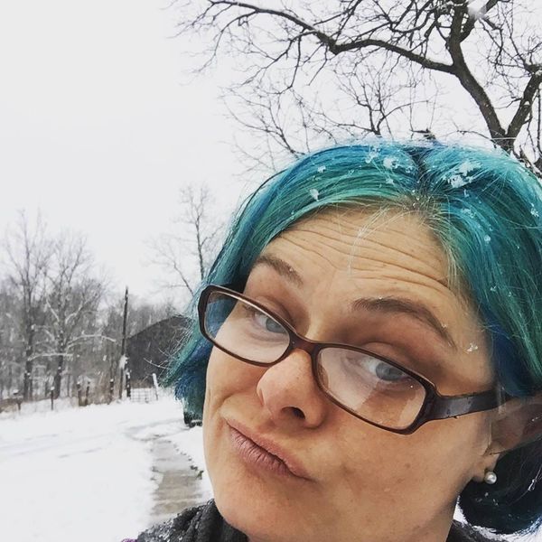 In my tall boots, raking out whatever lands in front of me