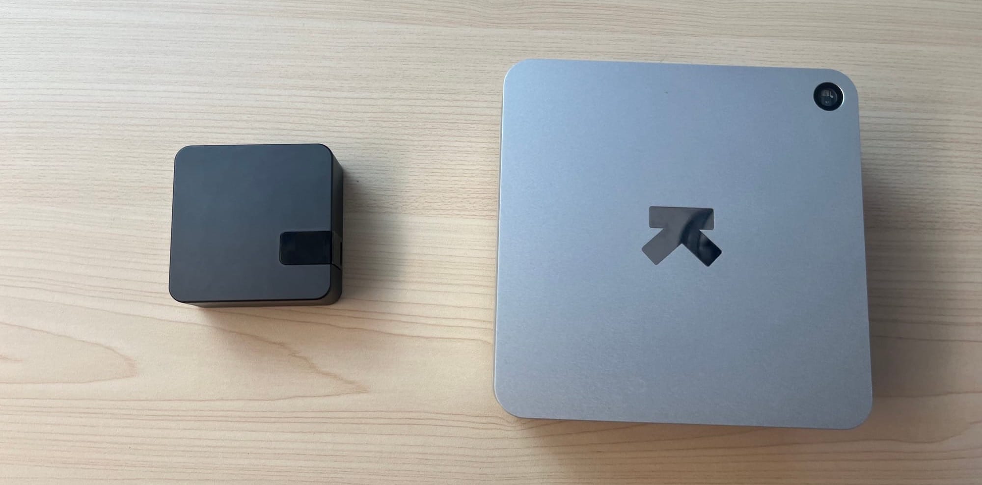 Ultrahuman PRO charging case next to the Ultrahuman Home device