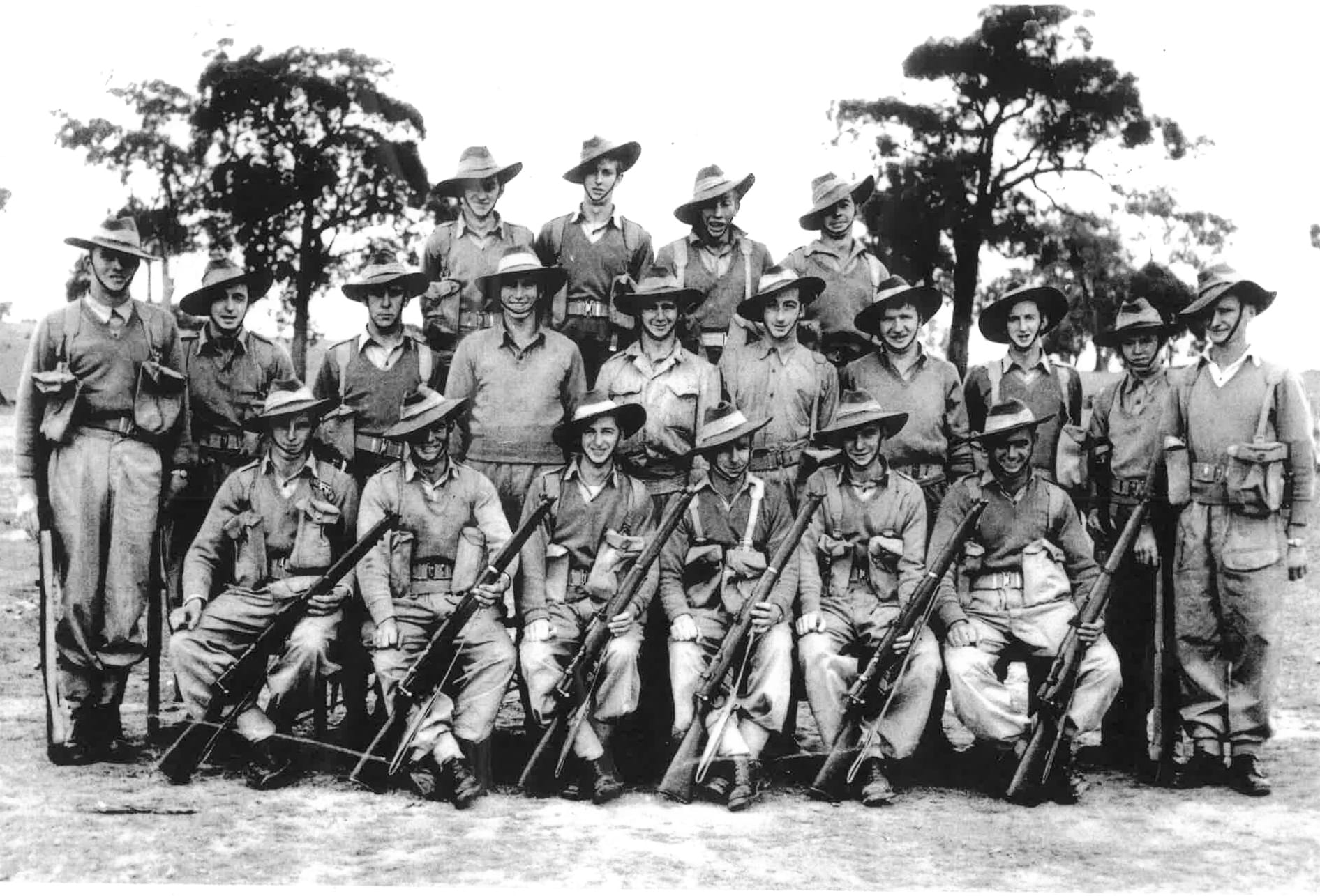 National Service approx. 1956: The Donald boys, back row, left to right, Jack Sweeny, ??, Ken Richards, Russell Hose. Middle row: Alan Wood, ??, Kevin Carne, ??, H Templar. Graeme Lang, ??, Noel  Whelan, Ernie Munro, ??. Front: Stuart McNally, F. Armstrong, Alan Sands, Brian Howley, G. Hines, Ron Henderson.
