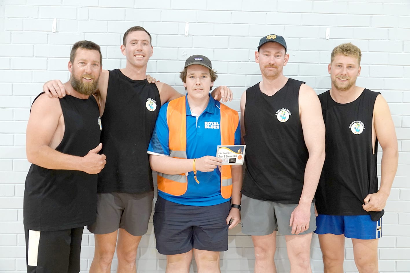 Winners of the 3-on-3 basketball: Sam Goldsmith, Sam Dunstan, Jacob Donnellon ( presenting prize from the show committee), Nathan Dunstan and Scott Wood. –Photo Jodie Drake.