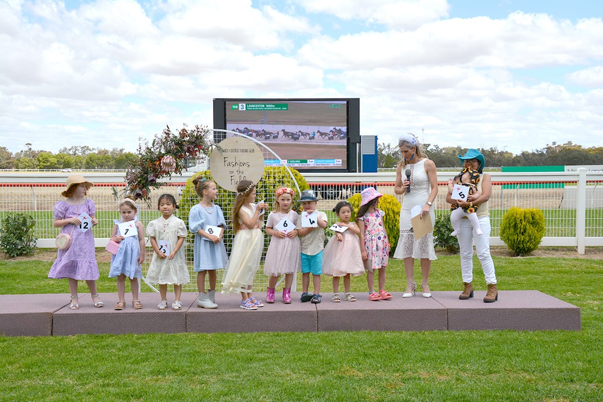 Casey Bruce interviews contestants for the Little Miss and Little Mister Fashions in the Field categories.