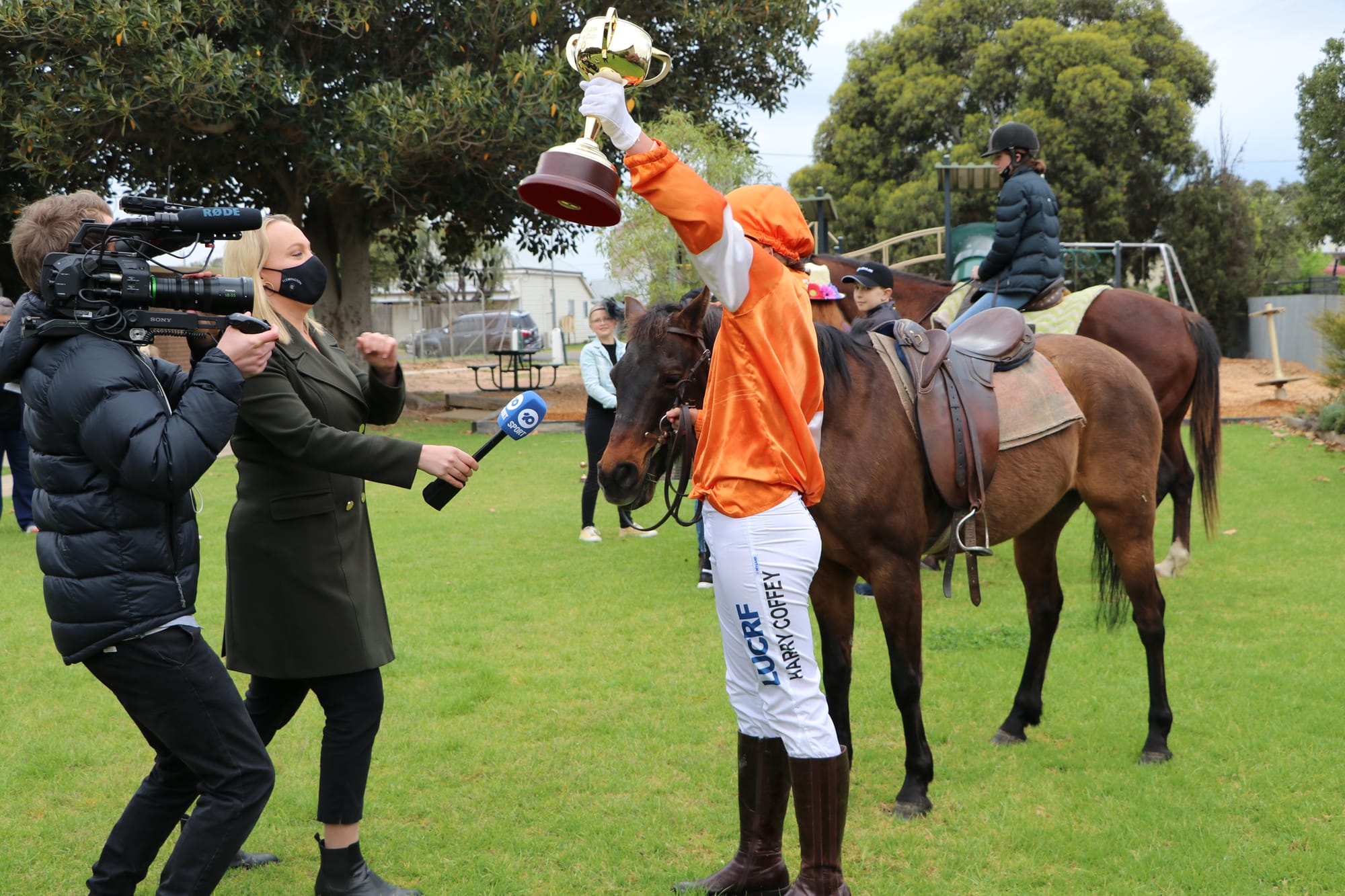 Eve Coffey, smiles for the camera again, a t.v. camera this time.