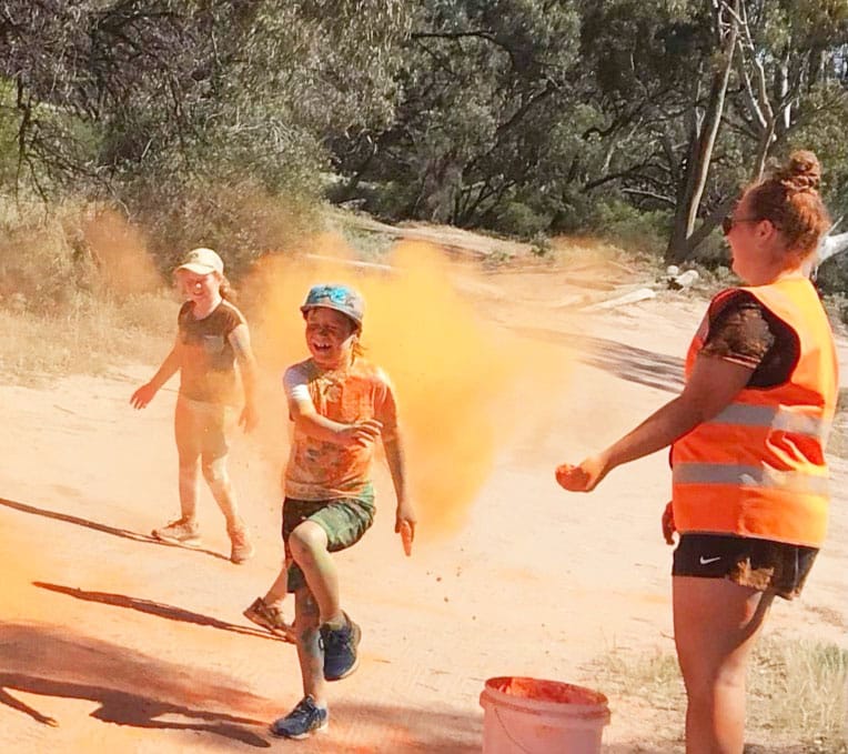 Charli, Tom and Lily McClelland enjoying colour day at Green Lake.