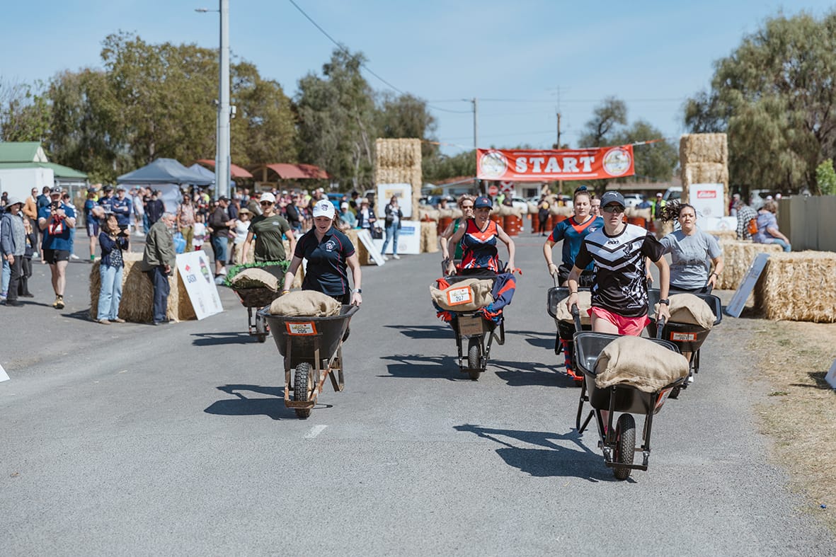 Off to a good start in the Women’s 20kg Wheelbarrow relay. (Photo by Laura Poyner.)
