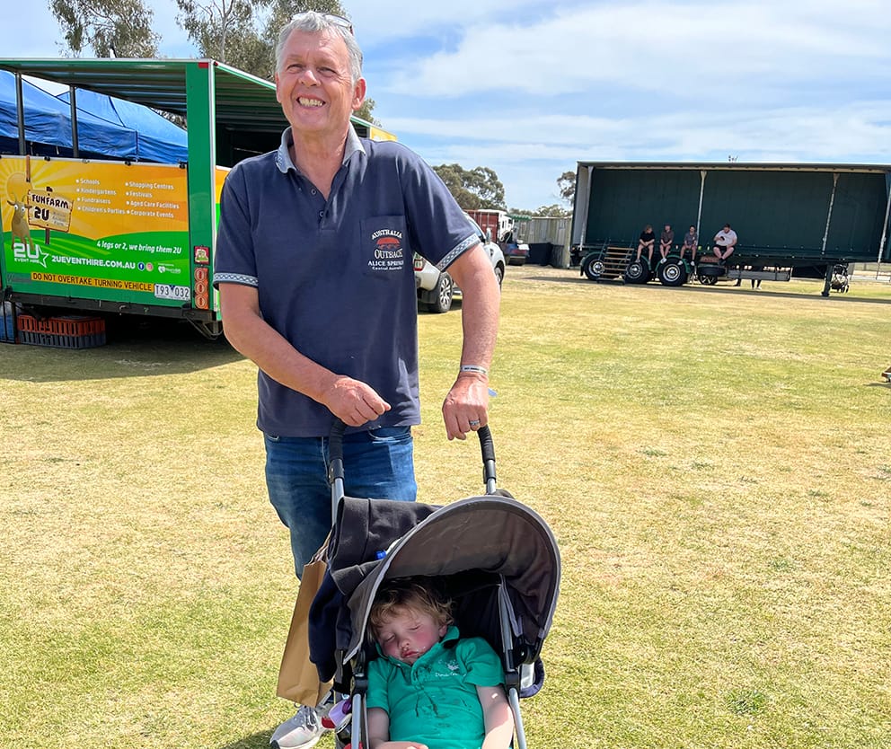 Graham Woods from Queensland with an exhausted grandchild in the pram, tired from all the fun of the fair.