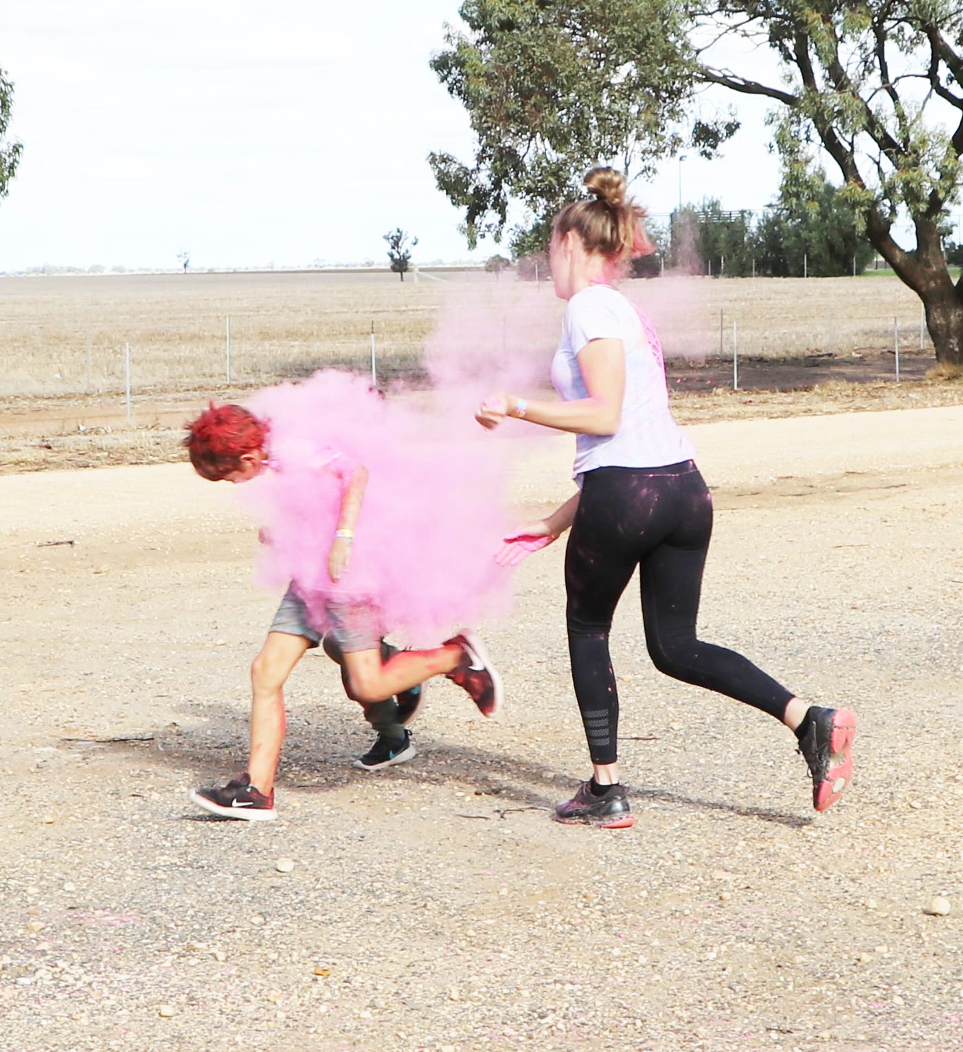 Des Coffey and River Ryan disappearing in a pink haze as they get caught by Hannah Cook. 