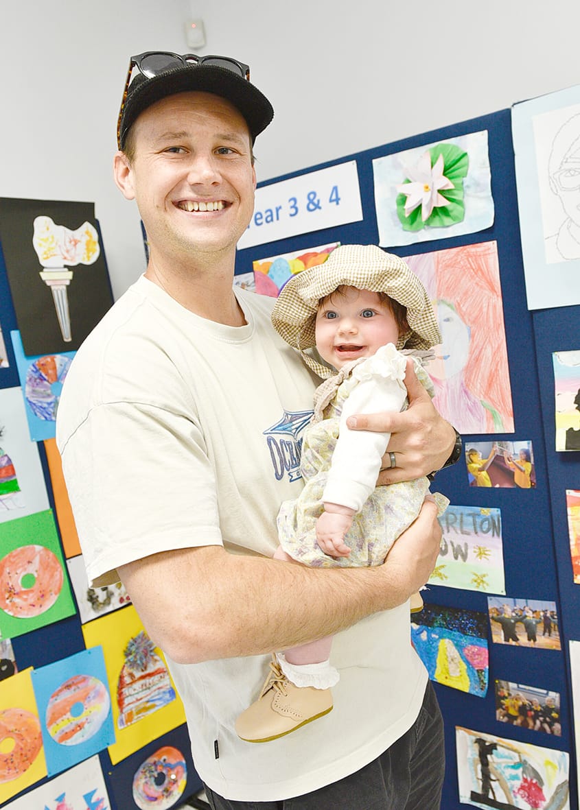 Introducing show day to a future competitor – Darcy McCallum is pictured with his five-month-old daughter, Bella in the schools display pavilion.