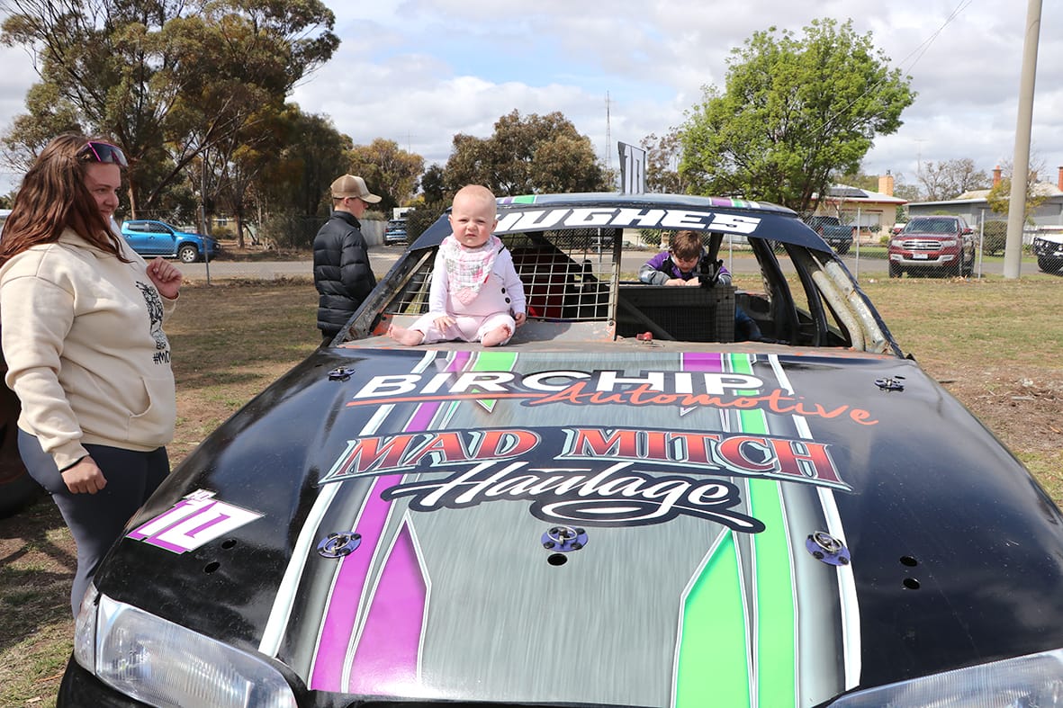 Melody Hollande on her Uncle Dean Hughes racing car.
