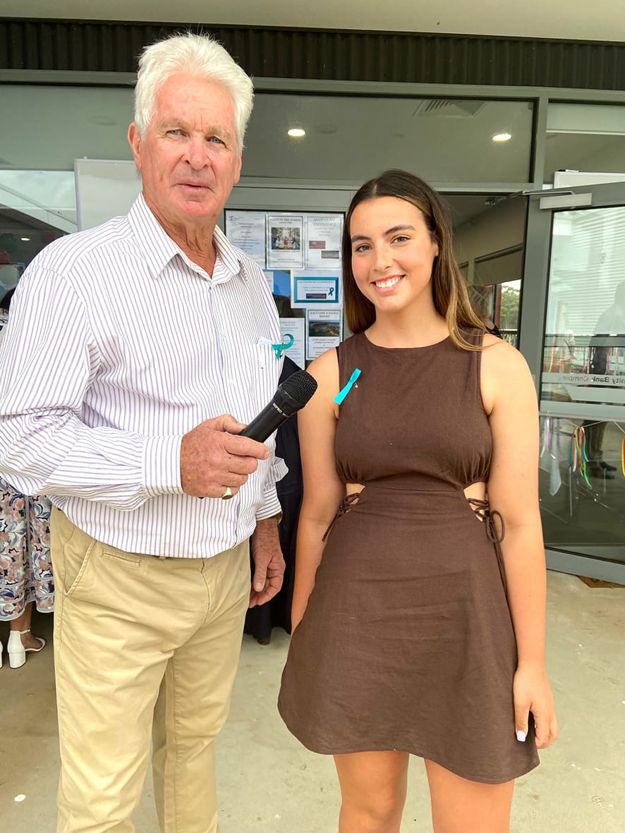Frank McGrath is pictured with young harness racing star Abby Sanderson who shared insights to the behind-the-scenes work involved in pursuing a career in this sport.