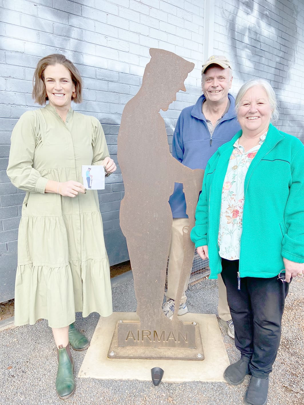 A family affair – Neil and Leonie McGillivray (right) whose son Judd provided the inspiration for the Air Force figurine, are pictured with Jade Benham, who is holding the photograph of Judd from which the cut-out was created.