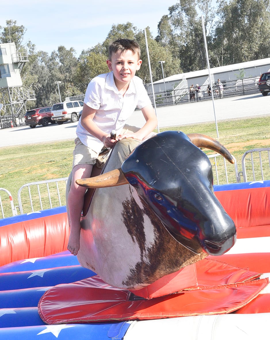 Seven-year-old Franklin Holmes-Brown enjoyed the action of the mechanised bull ride.