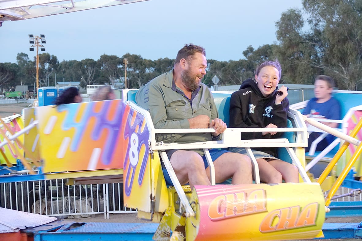 Brad and Nevaeh Pearse enjoy a ride on the ever popular Cha Cha. –Photo Jodie Drake.