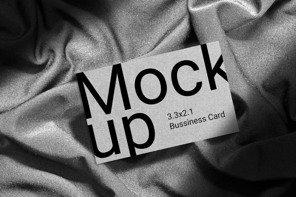 Realistic Gray Business Card Mockup on Fabric Surface