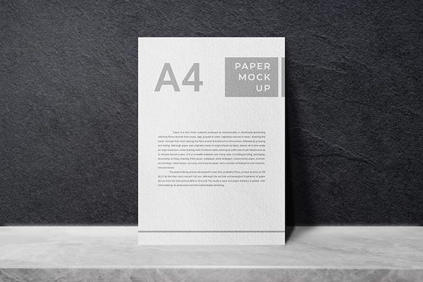 A4 Paper Mockup On Rough Black Wall Texture