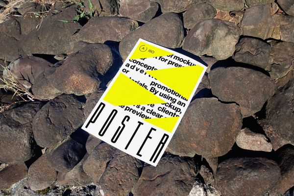 Realistic Outdoor Poster Mockup on Rocks