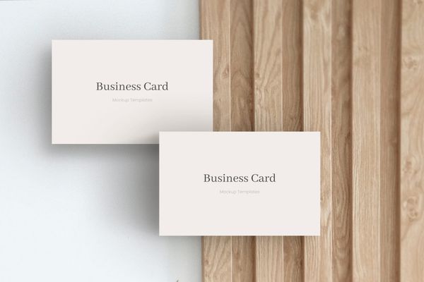 Two Business Card Mockup on Decorative Strip Wood Background