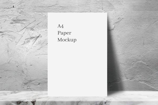 A4 White Paper Mockup with Rough Cement Wall Texture