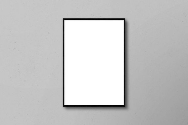 Vertical Poster Frame Mockup on Wall