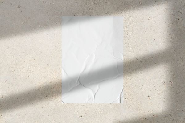 Glued Poster Mockup on Beige Textured Wall