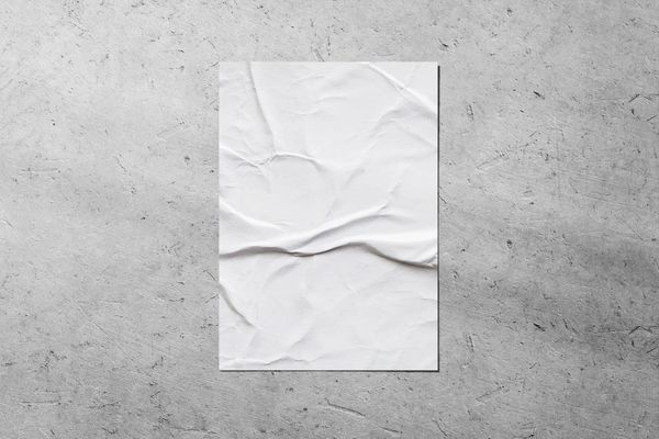 Glued Poster Mockup on Grunge Wall Surface
