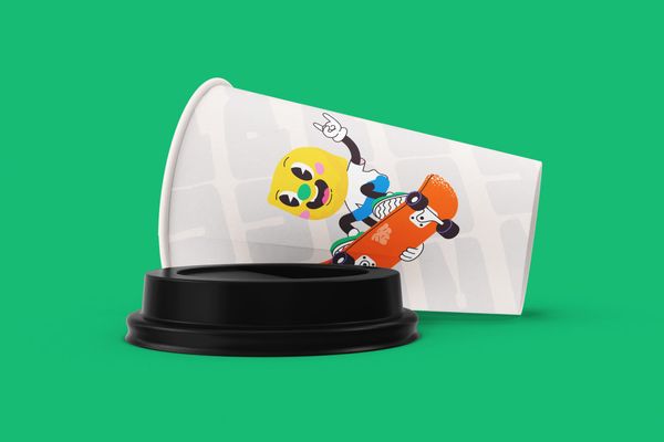 Paper Cup Mockup with Skater Character Illustration