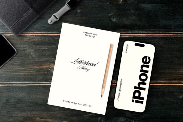 Letterhead and iPhone Mockup on Dark Wooden Desk