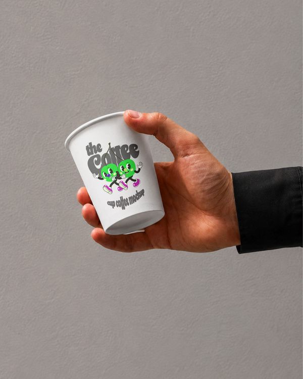 Hand Holding Paper Coffee Cup Mockup