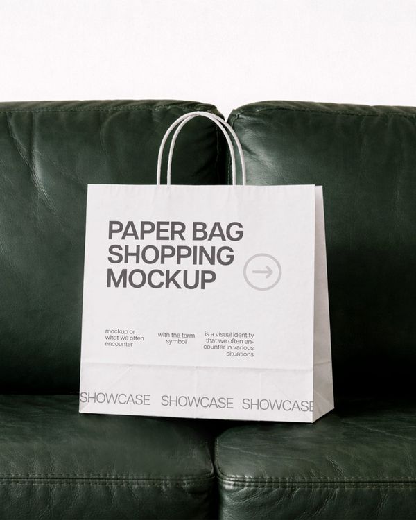 Luxury Shopping Paper Bag Mockup on Leather Sofa