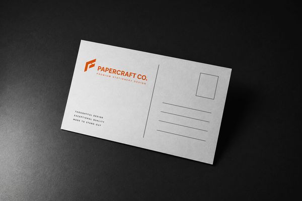 Minimalist postcard mockup with a realistic textured paper surface and clean stationery presentation.