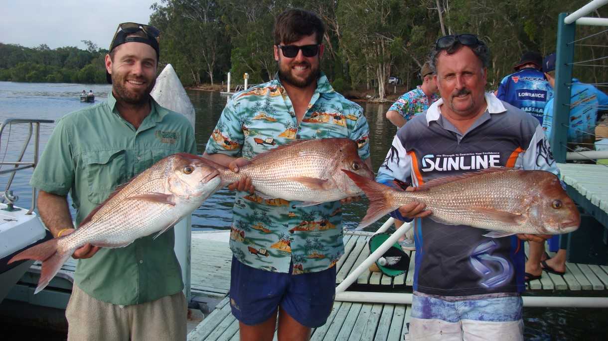 Dan Adamson (centre) and crew from Toowoomba pulled in these snapper at their Christmas party where they held a competition: