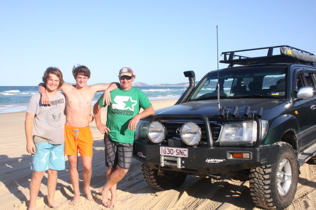 Regular visitors James Sharpe, Bailey and Paul Berriman from Gympie would like to see the beach fees disappear